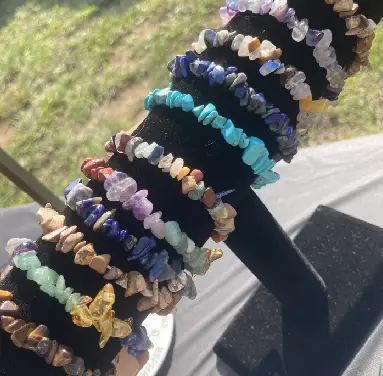 A bunch of bracelets are stacked on top of each other