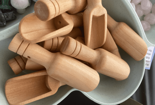 A bowl of wooden spoons and spatula