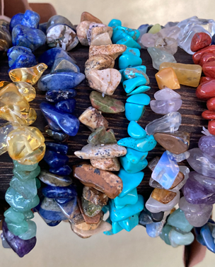 A bunch of different colored stones are on display