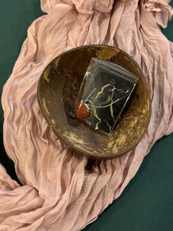 A bowl with a candle and some cloth