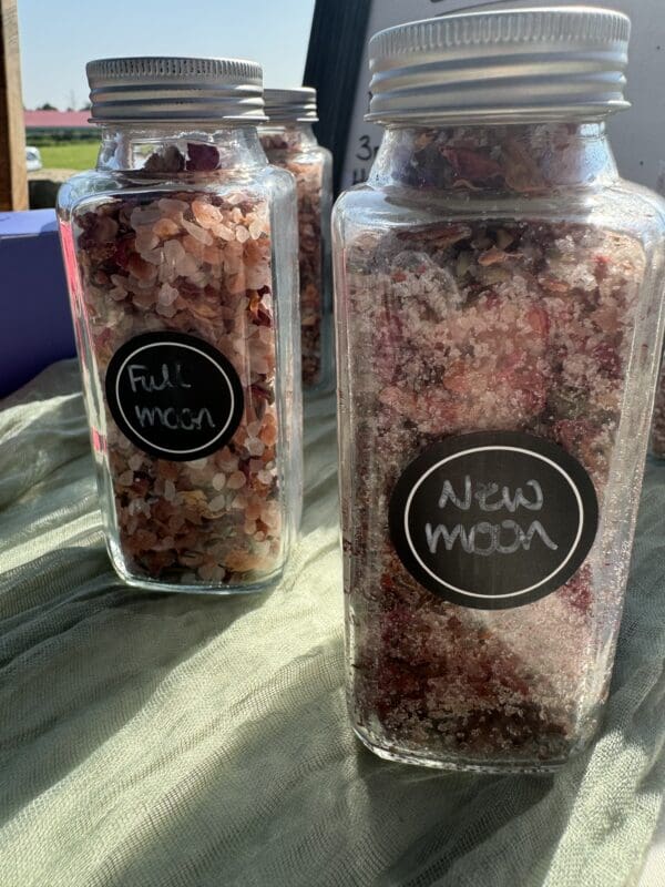 A couple of jars filled with food on top of a table.