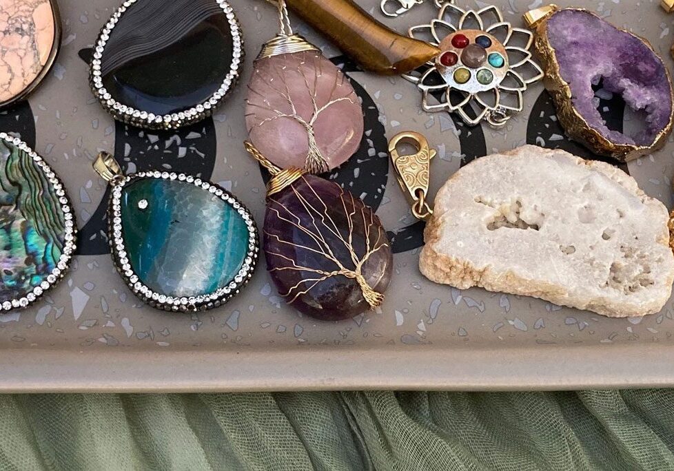 A tray of jewelry is shown with various stones.